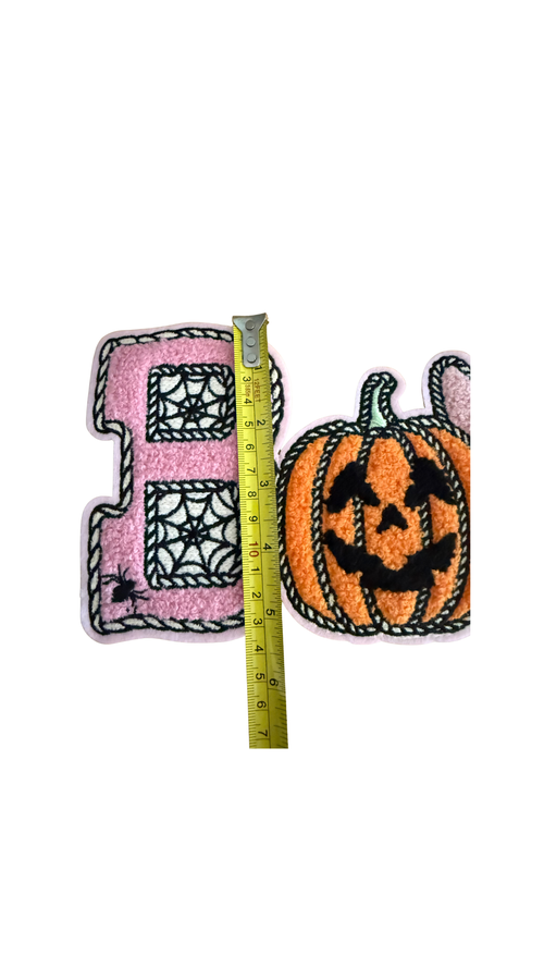 Featuring a plush pink chenille “B” filled with spiderweb details, a classic orange jack-o’-lantern, and the cutest little pink ghost, this design mixes traditional Halloween fun with a trendy, girly twist.