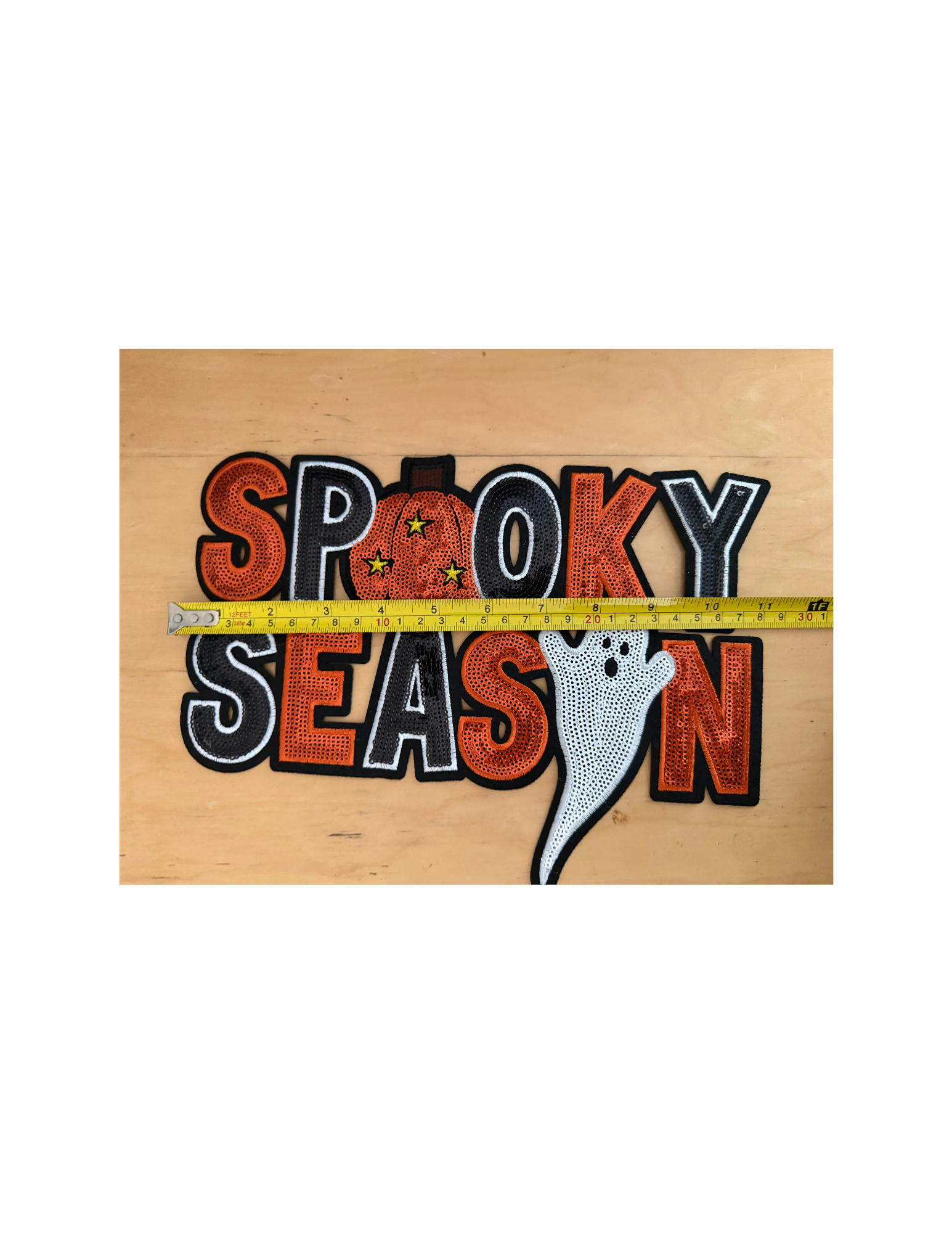 The bold orange, black, and white embroidery creates a classic Halloween look, while the playful pumpkin and adorable ghost give it just the right amount of personality.