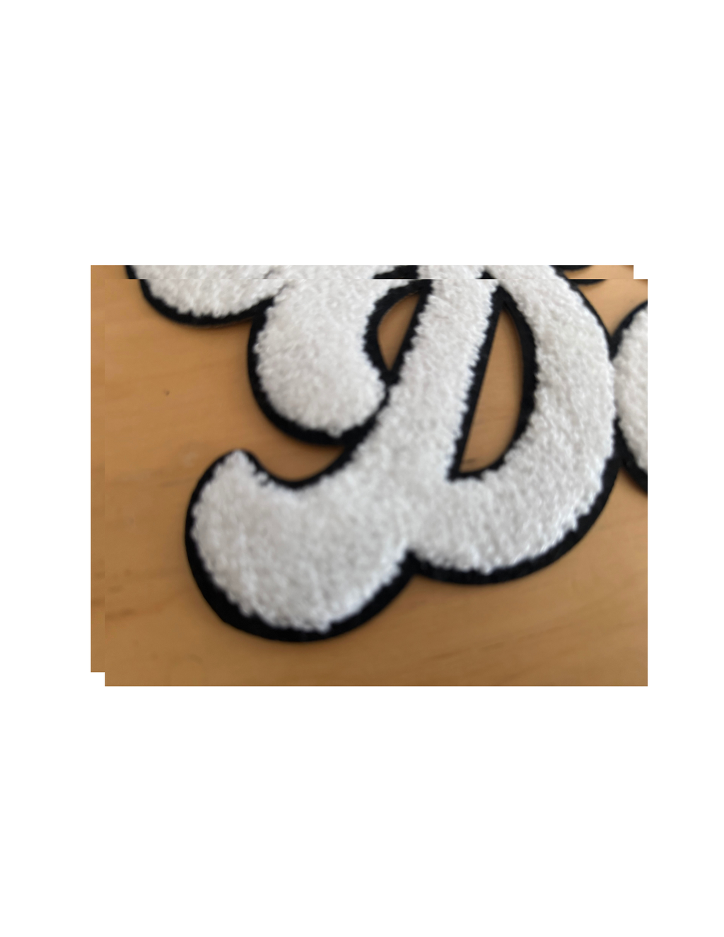 Turn up the team spirit with this bold and cozy Game Day Football Patch! Featuring a classic brown football paired with oversized, fluffy white chenille lettering, this patch delivers the perfect combination of sporty style and boutique texture.