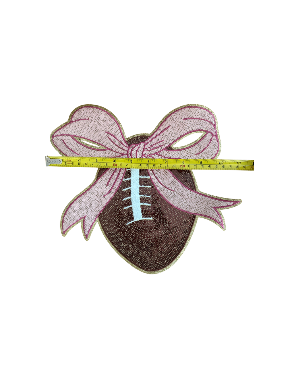 Football season meets feminine flair with this fabulous Football & Bow Patch! Featuring a richly textured football topped with an oversized sparkling pink bow, this design is made for the girl who loves touchdowns AND a little extra sparkle.