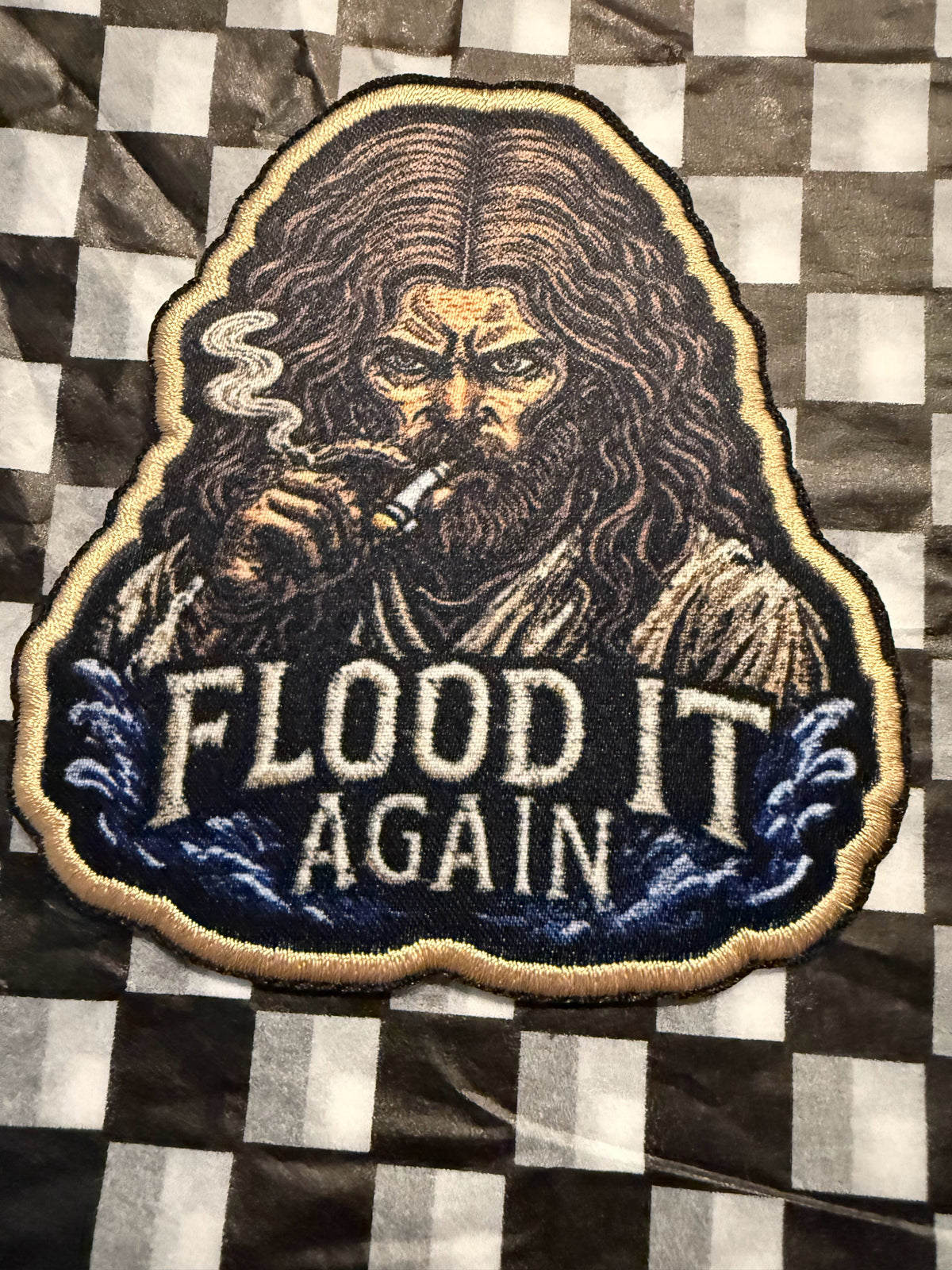 Make some waves with the “Flood It Again” embroidered iron on patch—a bold design made for anyone who appreciates rugged style, dark humor, and a little rebellious energy.