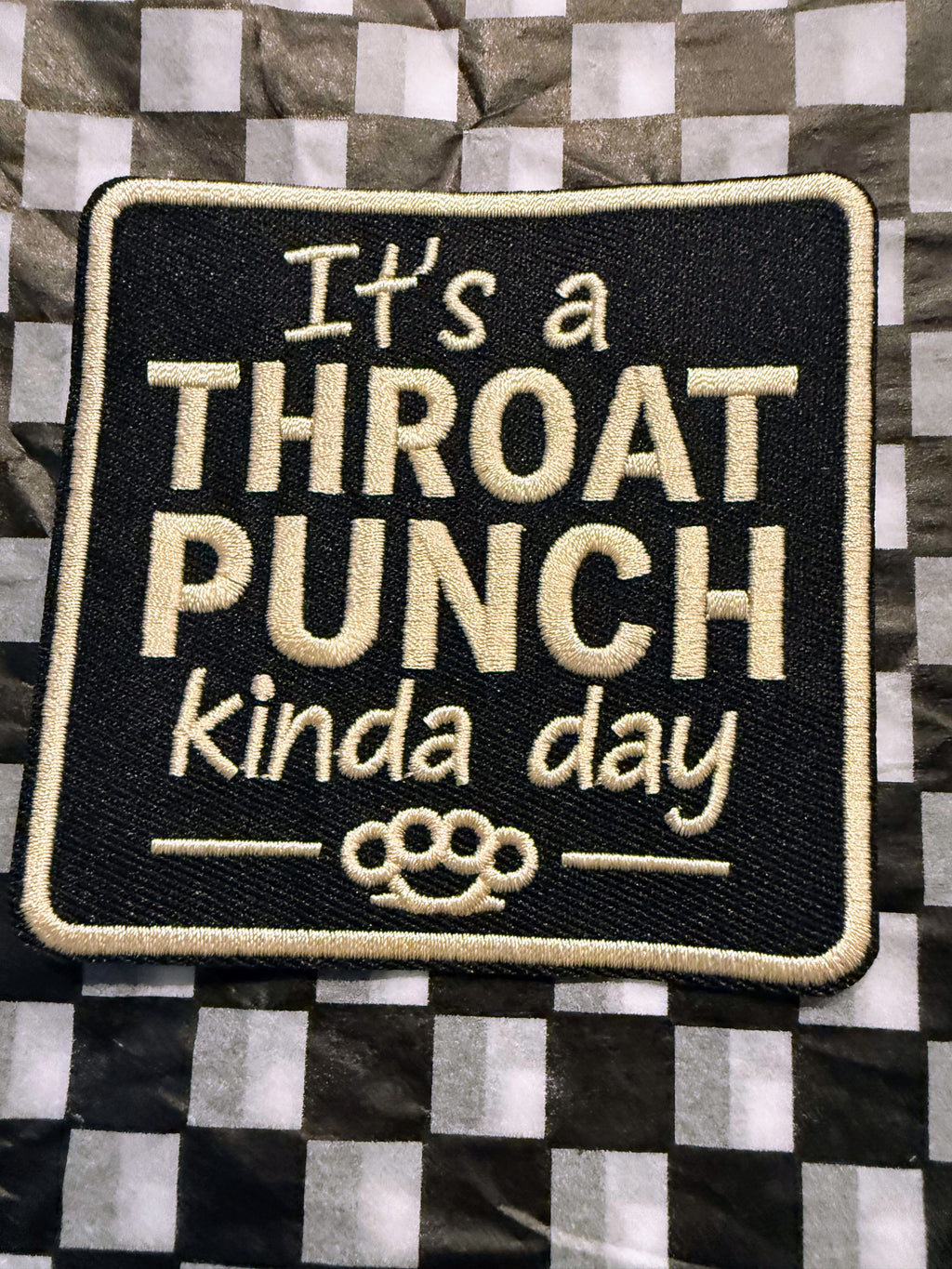 The “It’s a Throat Punch Kinda Day” embroidered iron on patch serves up bold attitude with just the right amount of sarcasm.
