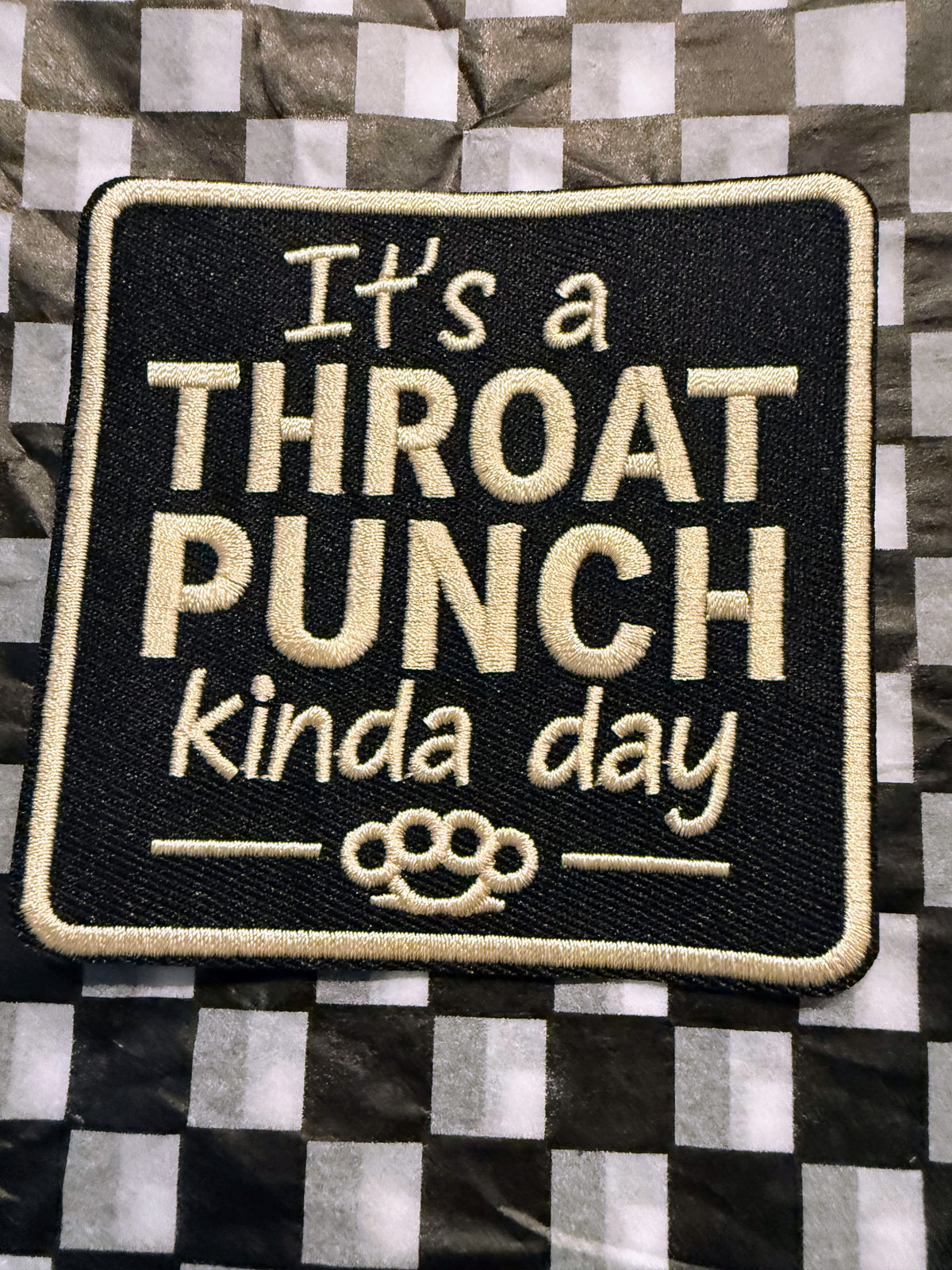 The “It’s a Throat Punch Kinda Day” embroidered iron on patch serves up bold attitude with just the right amount of sarcasm.