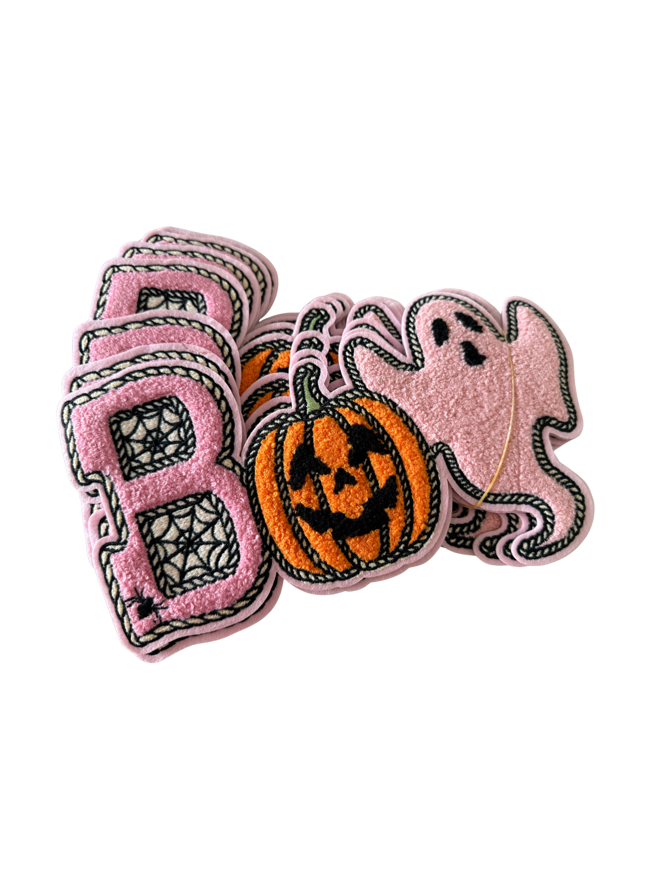 Featuring a plush pink chenille “B” filled with spiderweb details, a classic orange jack-o’-lantern, and the cutest little pink ghost, this design mixes traditional Halloween fun with a trendy, girly twist.